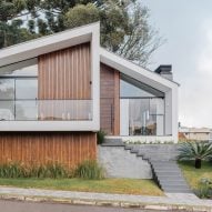 Studio KUNZ splits gabled Brazilian house into two trapezoidal forms