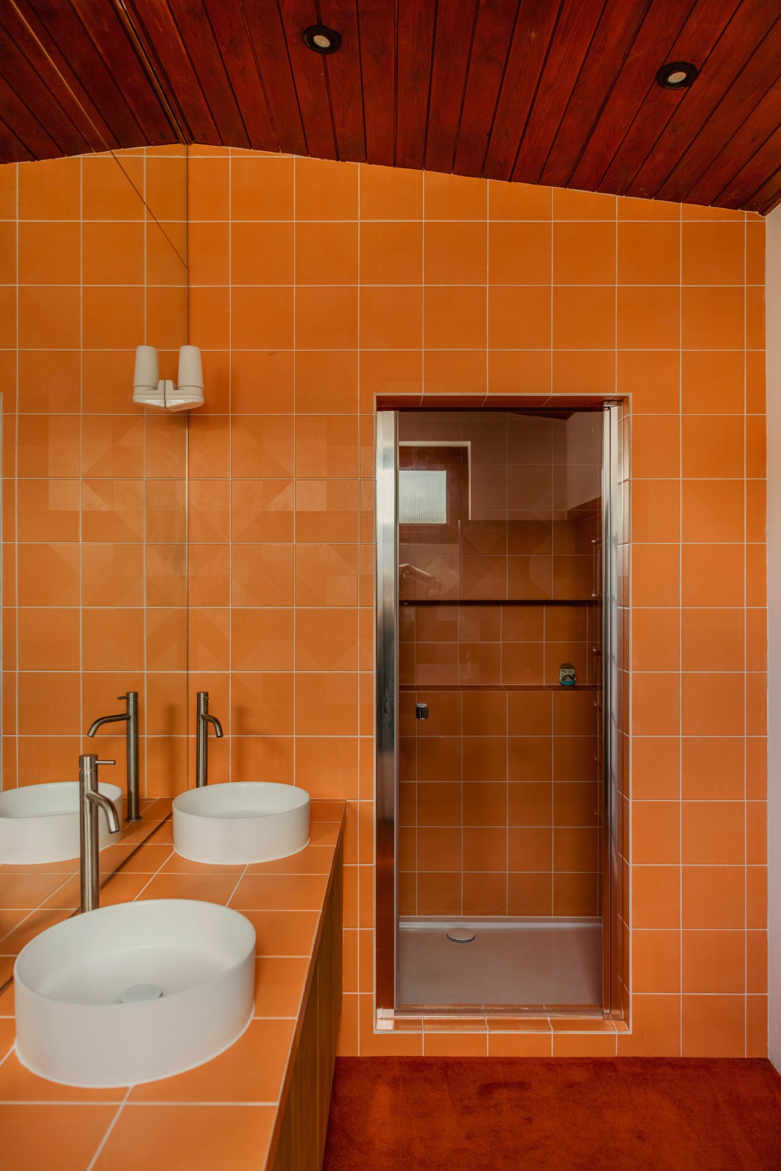 Bright orange walk-in shower