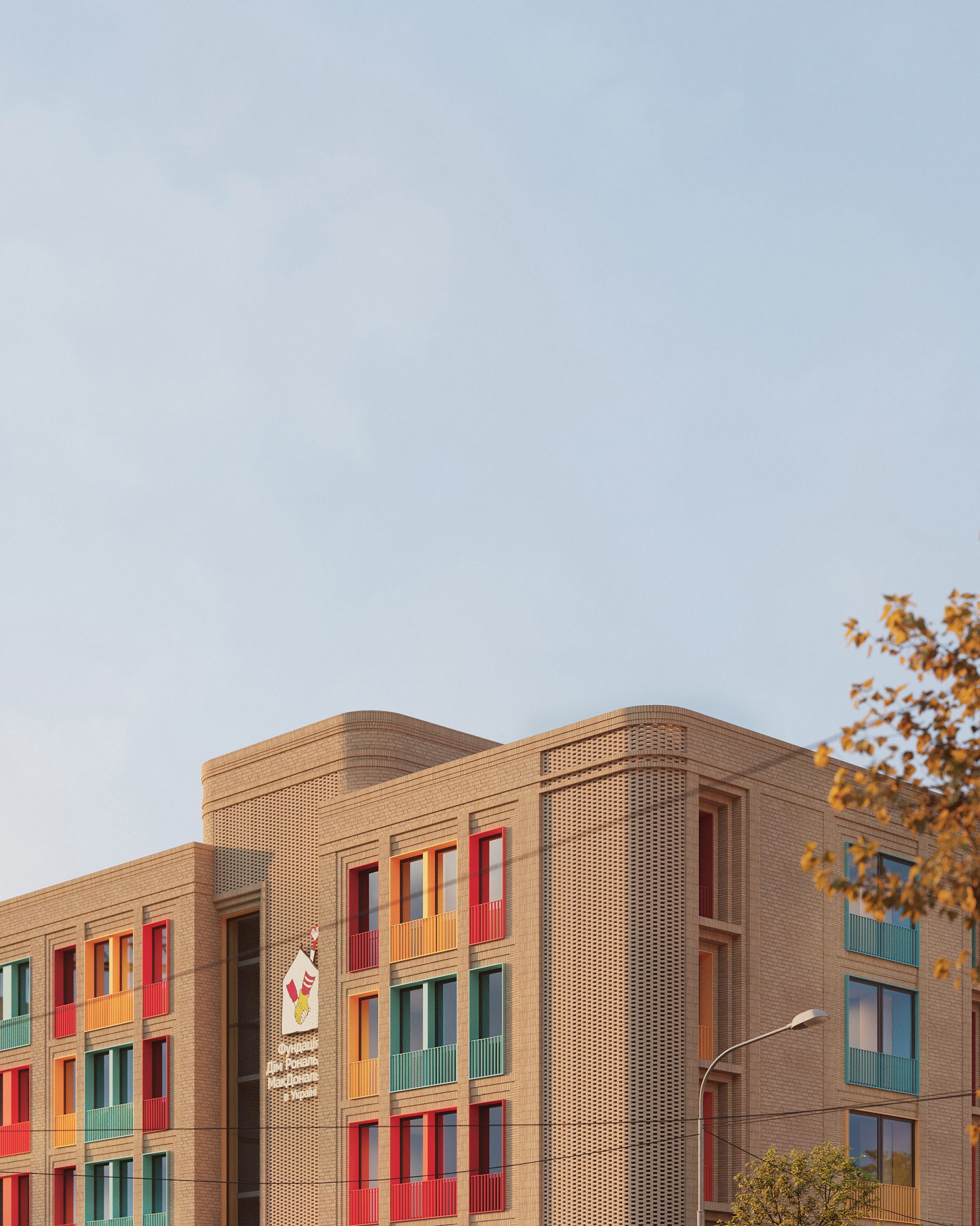Brick facade punctuated with colourful window frames at the Ronald McDonald House by ZikZak Architects