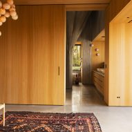 Bedroom with wooden walls and concrete floor