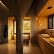 Bathroom in house with massive concrete pillar