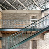 Green metal staircase in a blockwork school