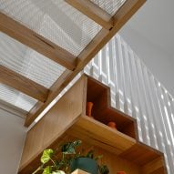 Metal bridge above staircase in Fitzroy house renovation by Austin Maynard Architects