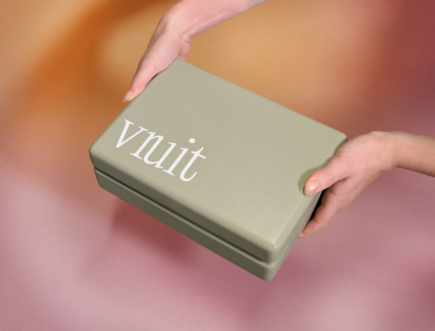 Close-up of person holding a box that says Vruit
