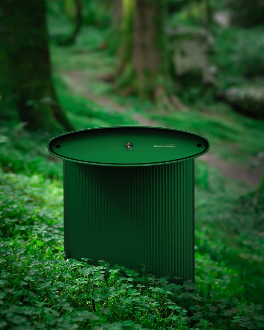 Bello! bench by Lars Beller Fjetland in the new forest green colour situated in a forest