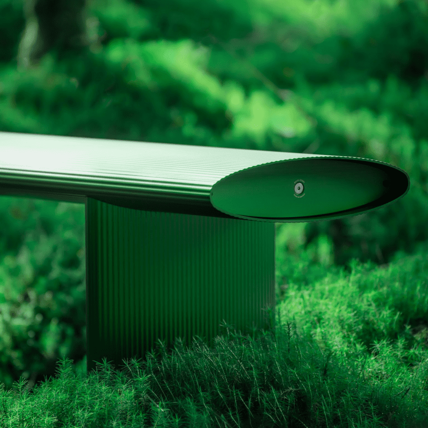 Bello! bench by Lars Beller Fjetland in the new forest green colour situated in a forest