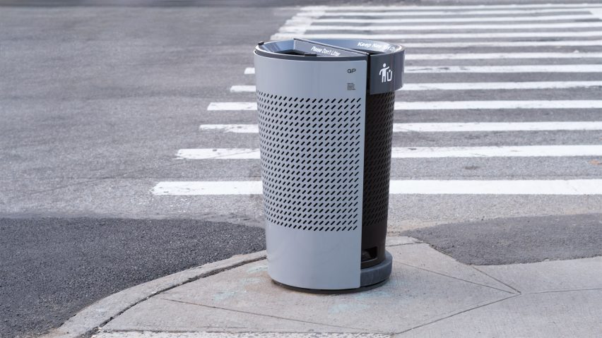 A trash can made of gray and black plastic