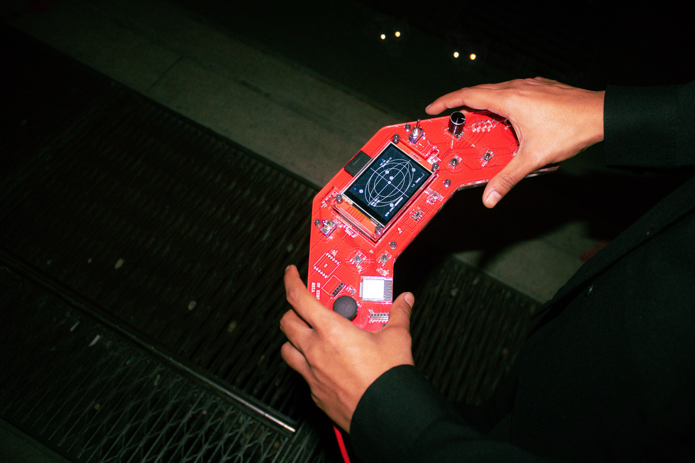 red hand held device similar to gameboy