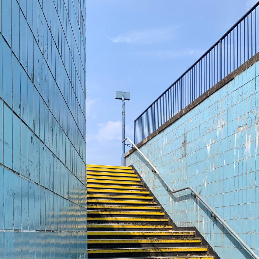 Yellow subway stairs against blue tiled wall Stourbridge