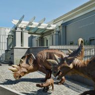 Dinosaurs outside of a museum