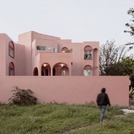 Heryco blends "history and modernity" in renovation of pink apartment block