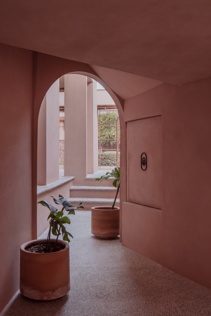 Arched motifs within pink Mexican apartment project