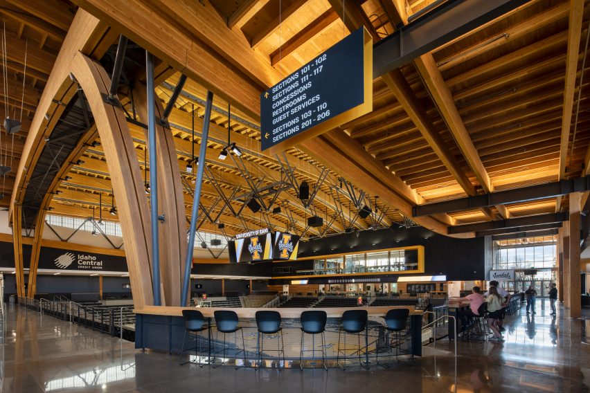 A cafe in a basketball court with mass timber construction