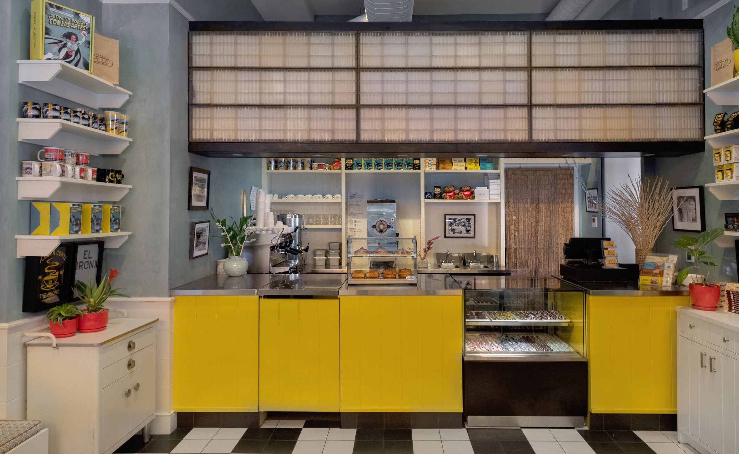 Yellow cafe counter with chocolate moulds installed above