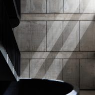 Black metal staircase in a concrete space