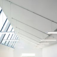 Gallery space with an asymmetrical pitched roof