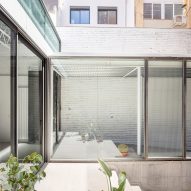 Remodelled Barcelona apartment with a glass extension by CRÜ