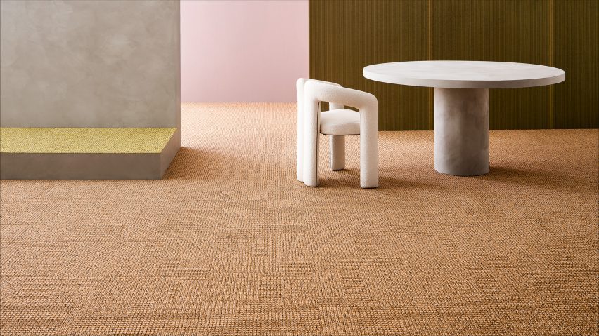 Beige coloured carpet with a white chair and table sitting on it