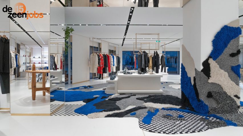 Shop interior with rug-like installation on walls and floors