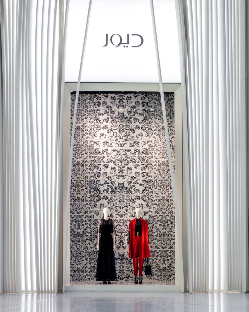 Two mannequins in a Dior store
