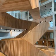 Criss-crossing timber staircases in an atrium