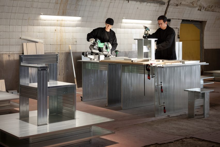Daisuke Yamamoto and Takeo Masui building a recycled steel chair