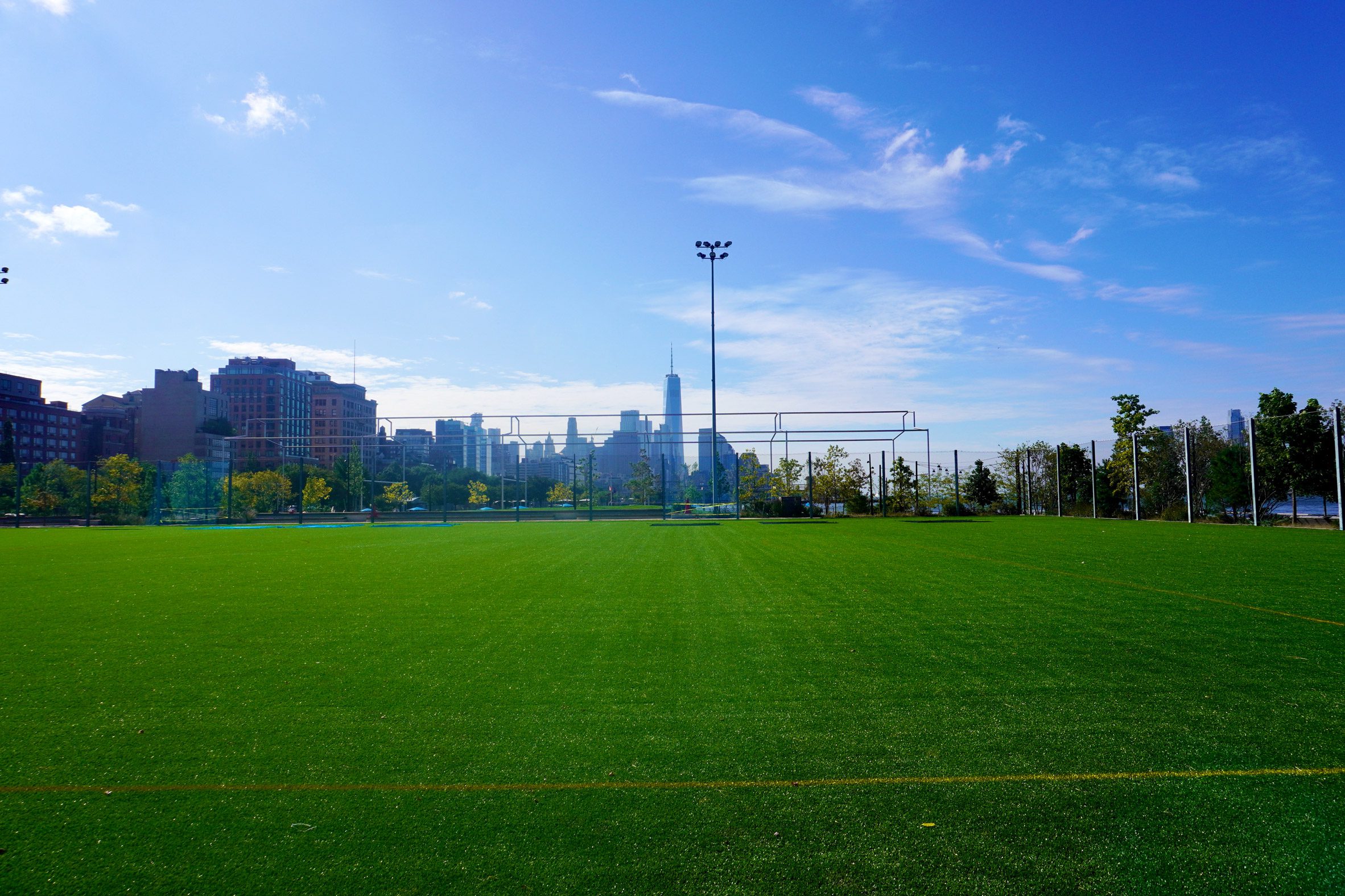 Playing field with downtown Manhattan skyline in the background