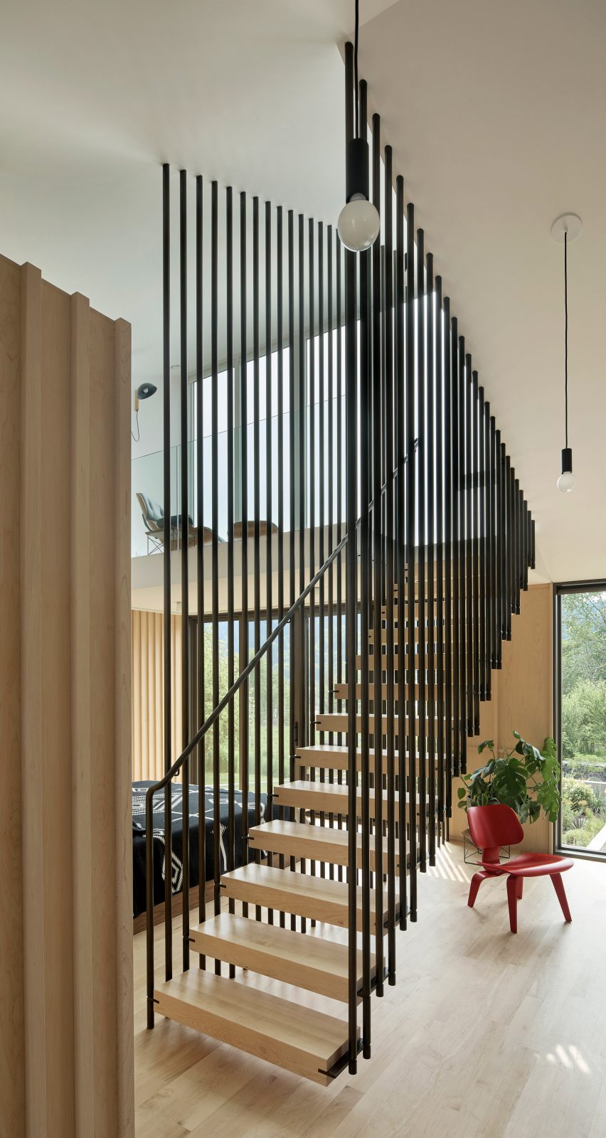 Floating staircase with metal railing