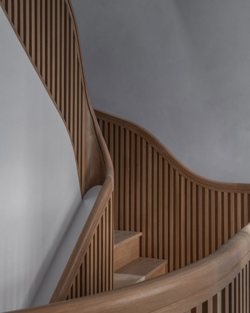 Detail of white oak staircase with rounded handrail