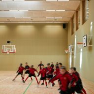 School children playing in a sports hall