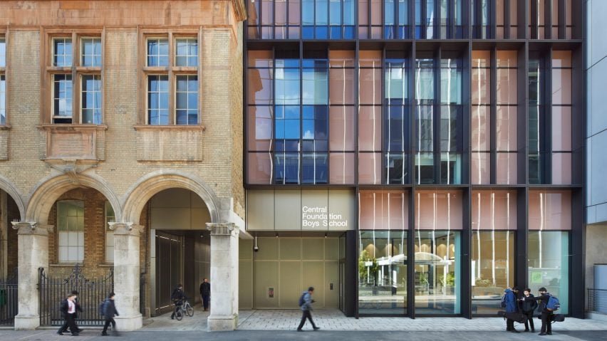 Historic building with arches next to a black metal and glazed facade at the Central Foundation Boys' School in London