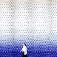 Geometric wall tiles fading from blue to white