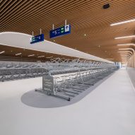 Interior view of IJboulevard bike parking facility by VenhoevenCS Architecture + Urbanism
