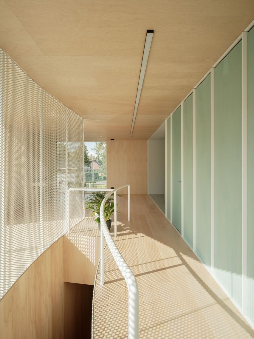 Timber-clad corridor in the BEEV home in Belgium