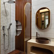 White tile and wood bathroom interior