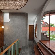 Staircase landing at Distracted House by Ismail Solehudin Architecture