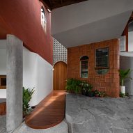 Concrete and wood interior of Distracted House in Indonesia by Ismail Solehudin Architecture