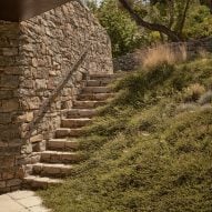Stone steps leading to the Liknon building by K-studio
