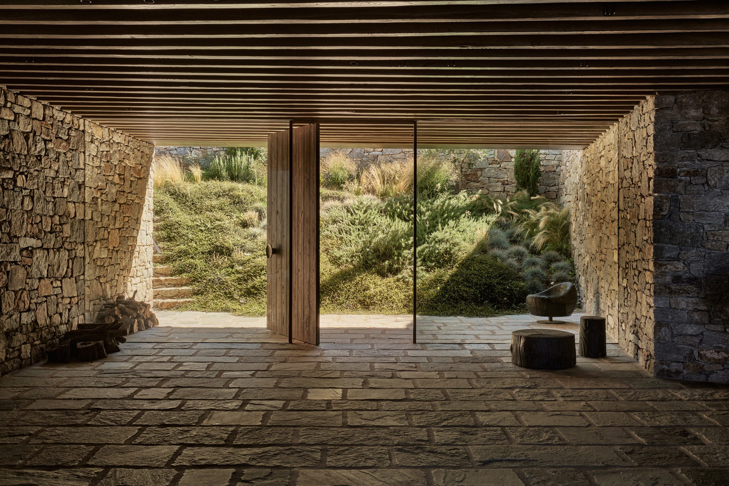 Glass doors in a stone room on a hillside