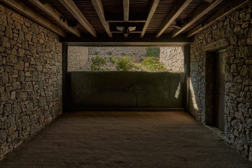 Interior space with stone walls and timber ceiling beams