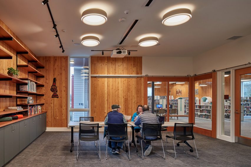 A meeting room in a library with wood panel walls