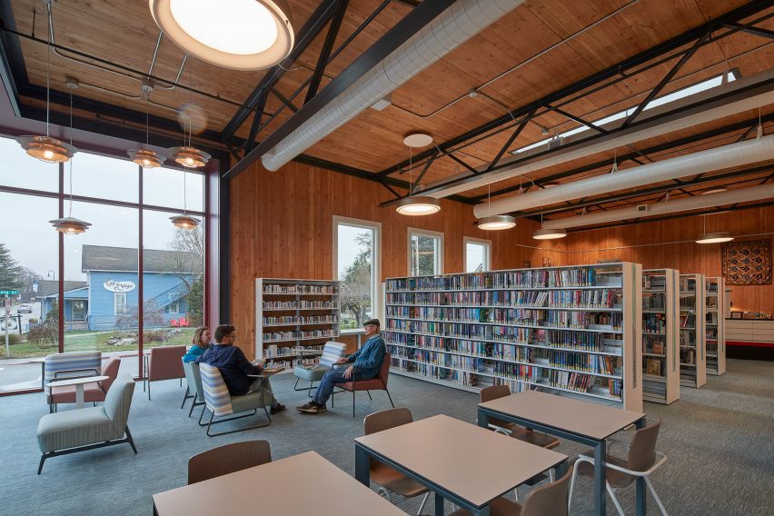 Bookshelves in a library with wood walls