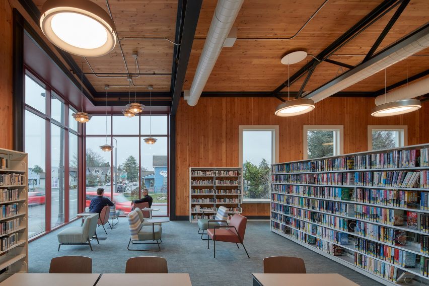 Bookshelves in a library with wood walls