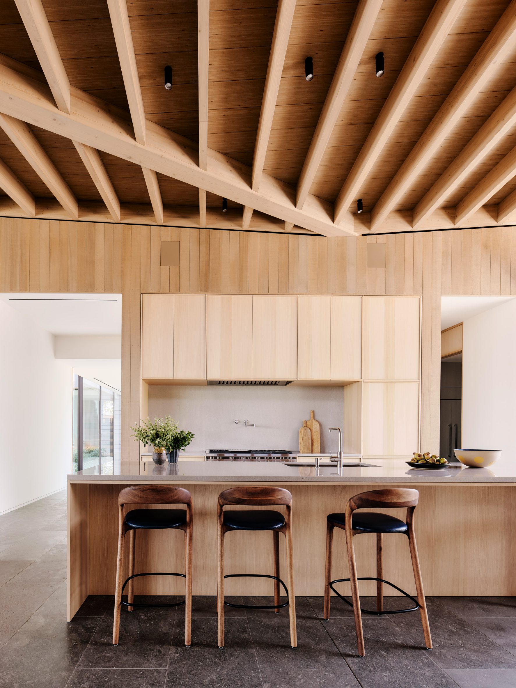A kitchen with post and beam ceiling