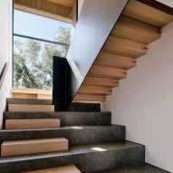 A stone staircase with wood elements