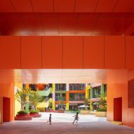 Orange semi-outdoor space at Shenzhen Women and Children's Centre by MVRDV