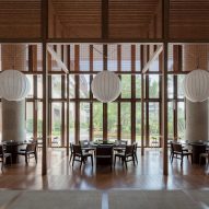 Wooden hotel lounge interior with spherical lantern lights