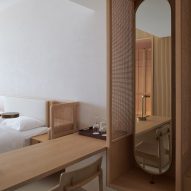 Hotel bedroom interior with rattan screens and wood furniture