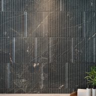Grey tiles on bathroom wall