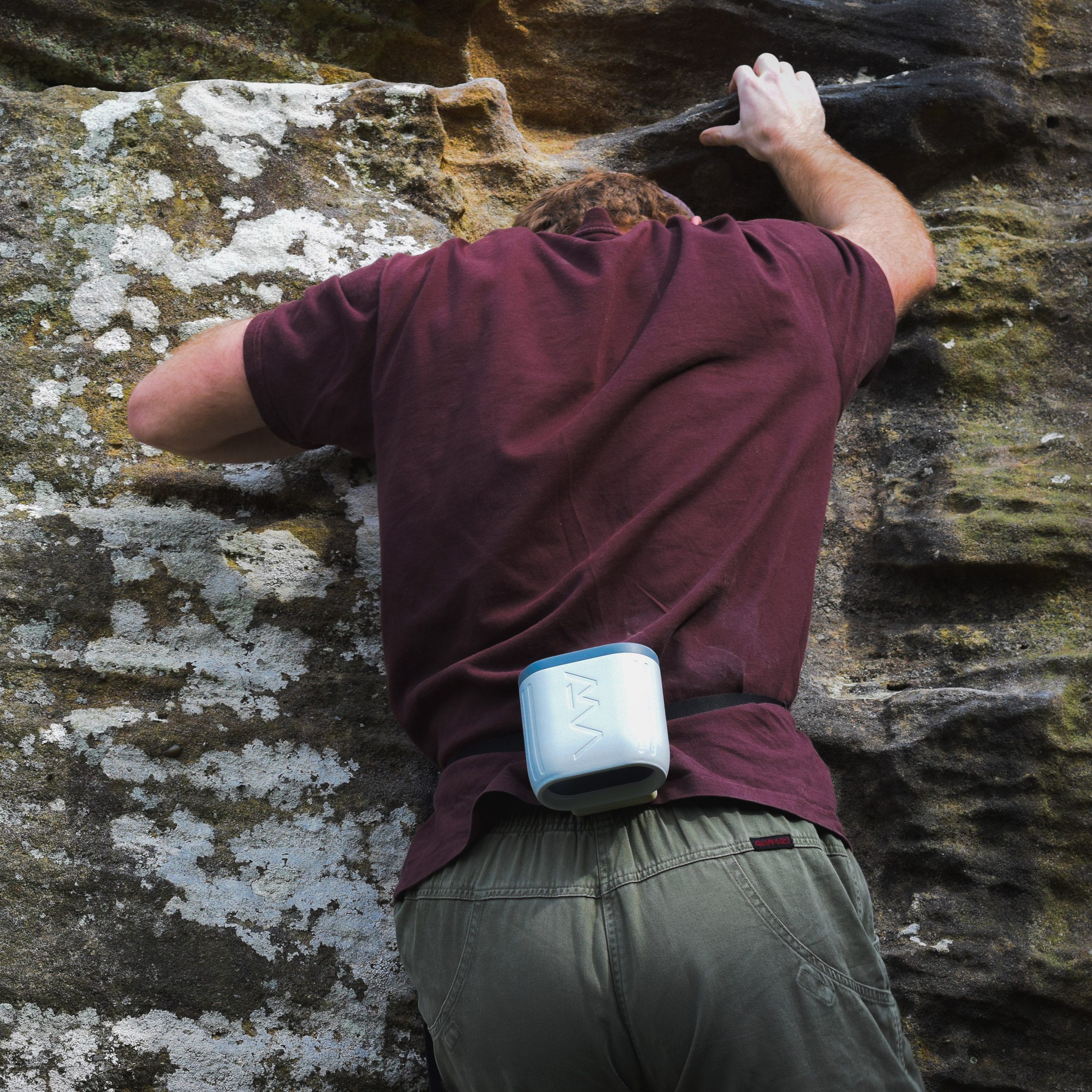 Photograph showing climber with portable fan attached to their back
